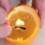 derramar azeite em uma tangerina para obter luz